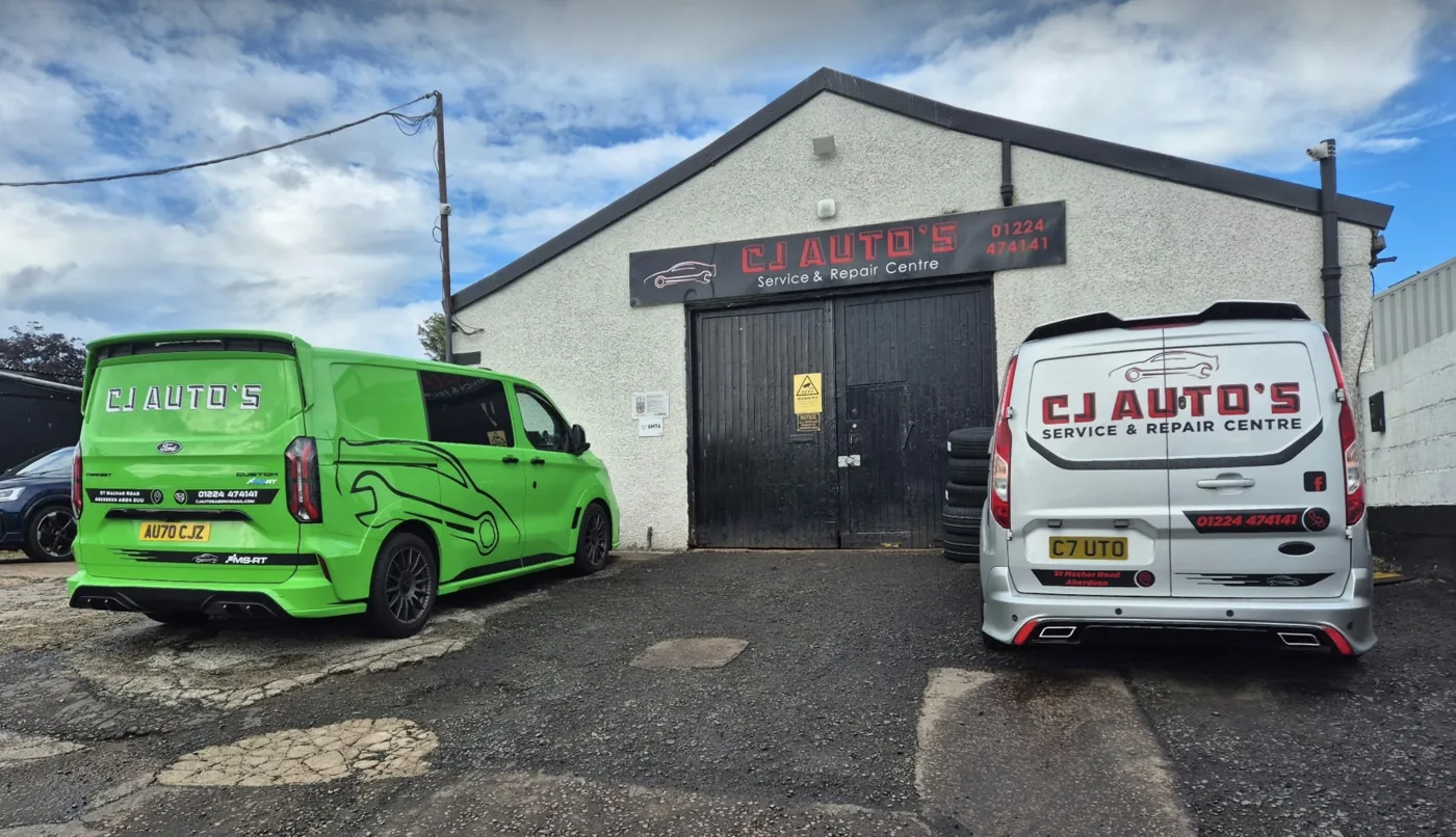 CJ Auto's Service & Repair Centre premises in Aberdeen with branded vans outside